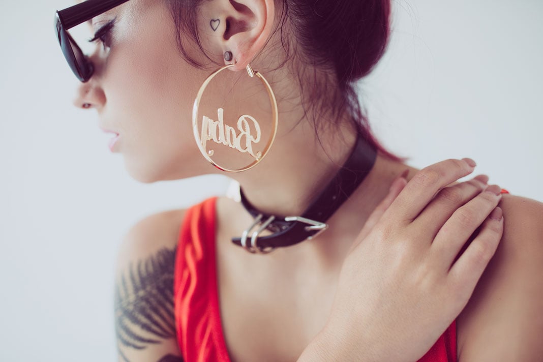 attractive-stylish-girl-in-sunglasses-posing-for-hoop-earrings-for-women-nhew-002