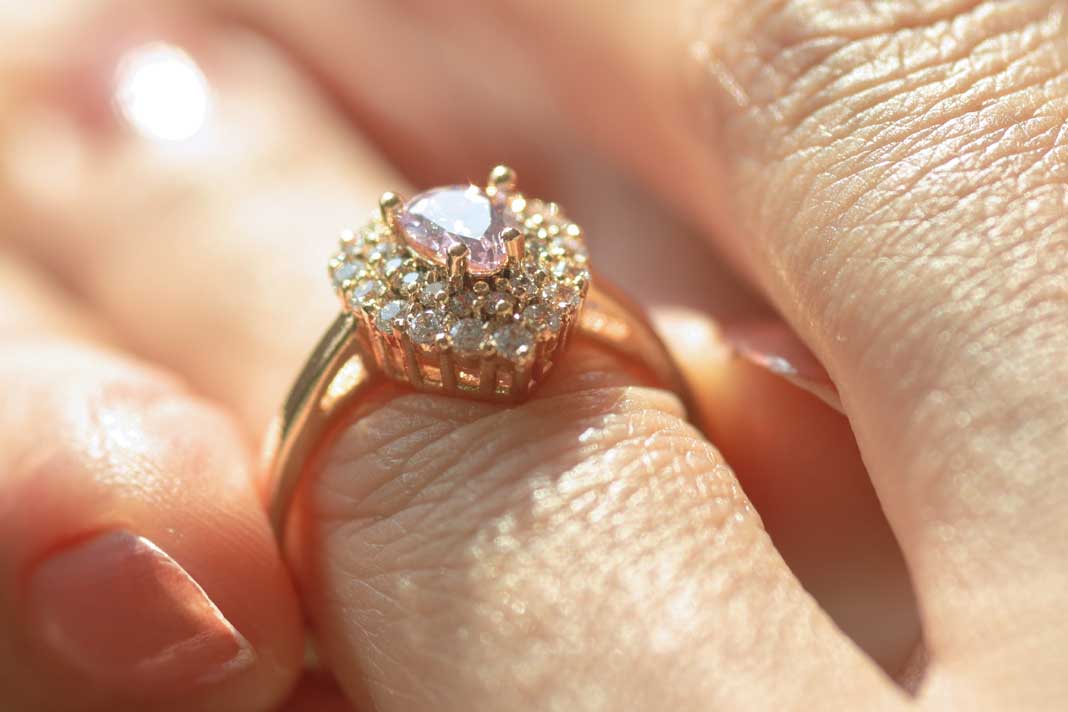 beautiful-close-up-view-of-a-diamond-ring-and-woman-hand-nerw